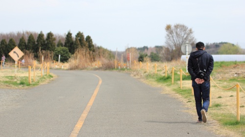 A person walking on a road.