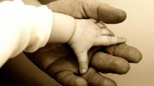 Baby hand on top of a big hand - God&#039;s Family: The Reason You Were Born 