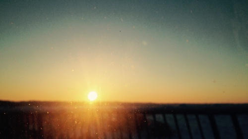 Orange sunset through a glass window.