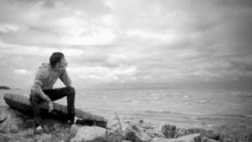 Boy on rock looking at water - If a Man Die, Will He Live Again?