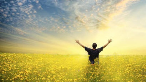 A man raising his hands to the sky.