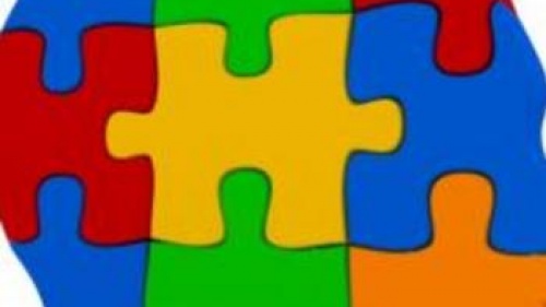 Multi-colored jigsaw puzzle pieces that make shape of human head - Just For Yout
