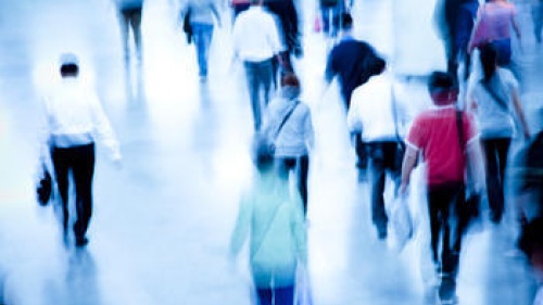 A crowd of people walking.