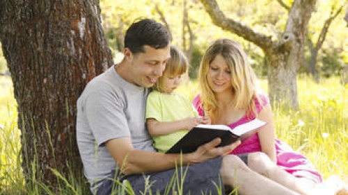 A family reading the Bible together.