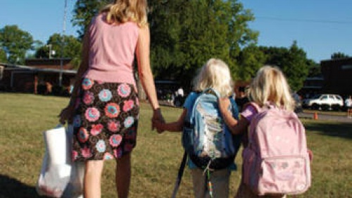 mom and daughters going to school