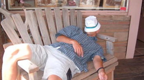 man sleeping on a bench