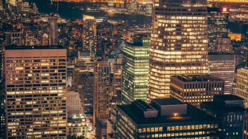 City buildings lit up a night.