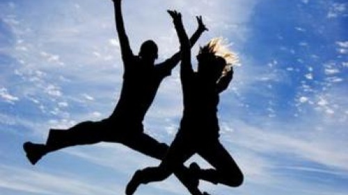 two people jumping in the air