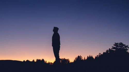 A man looking up at the stars.