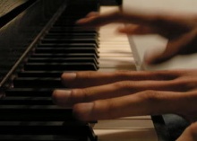 hands playing piano