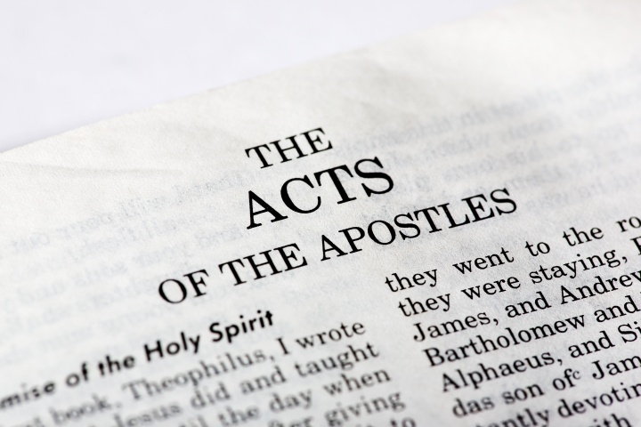 Bible opened to the book of Acts.