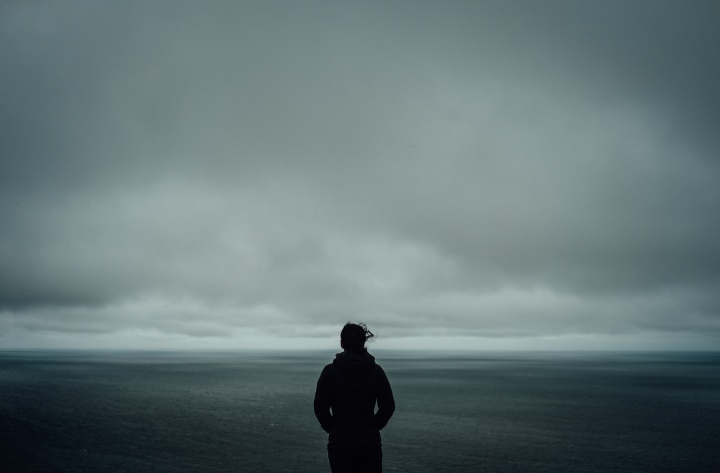 A person looking out at a body of water.