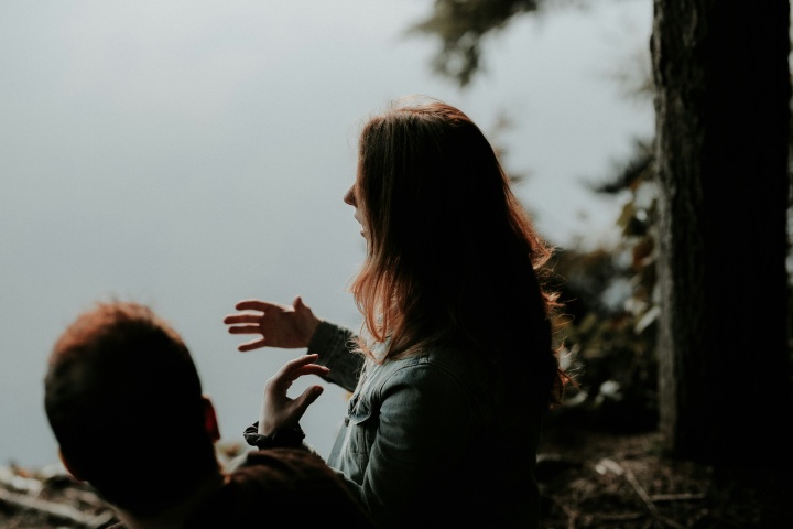 A woman talking to a friend.