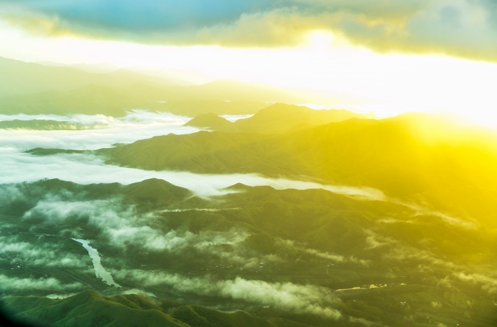 A sun glare over a valley.