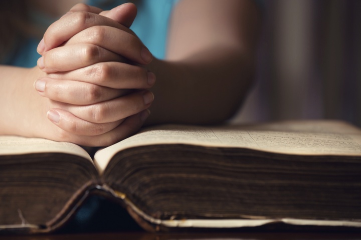 A person reading a Bible.