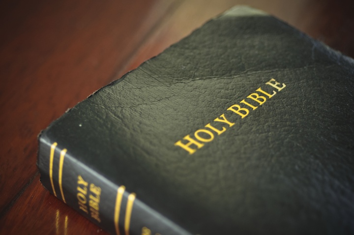 A Bible laying on a table.