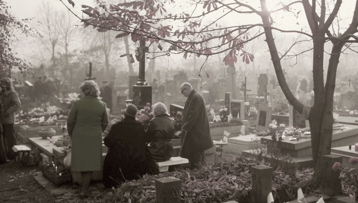 People at a grave site.