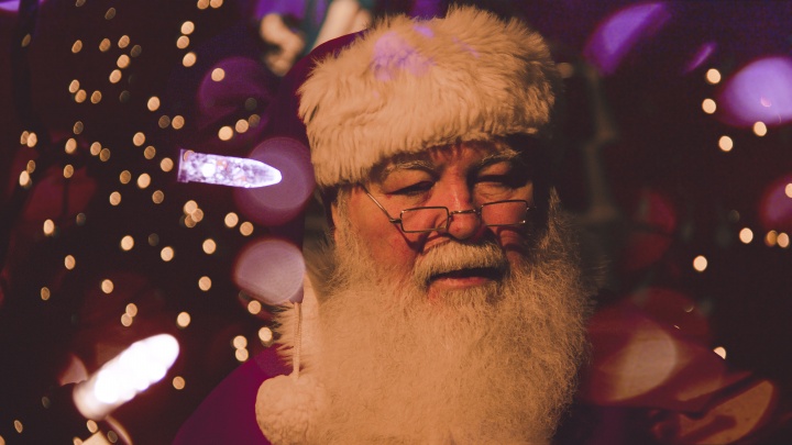 A person dressed up as Santa Claus.