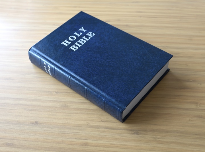 Bible laying on top of a table.