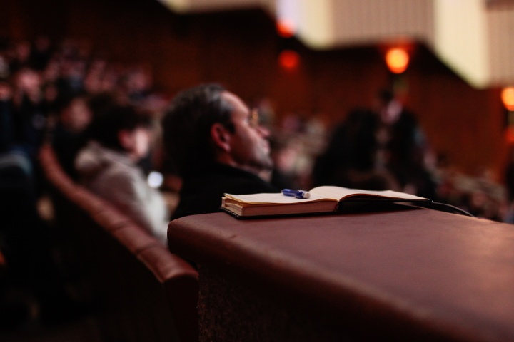 An audience listening.