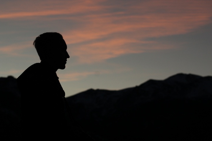 A silhouette of young man.