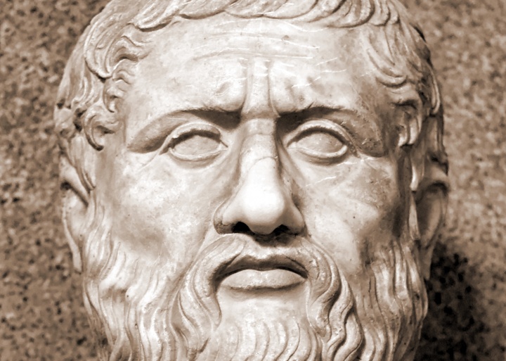 A bust of Plato's face in stone.