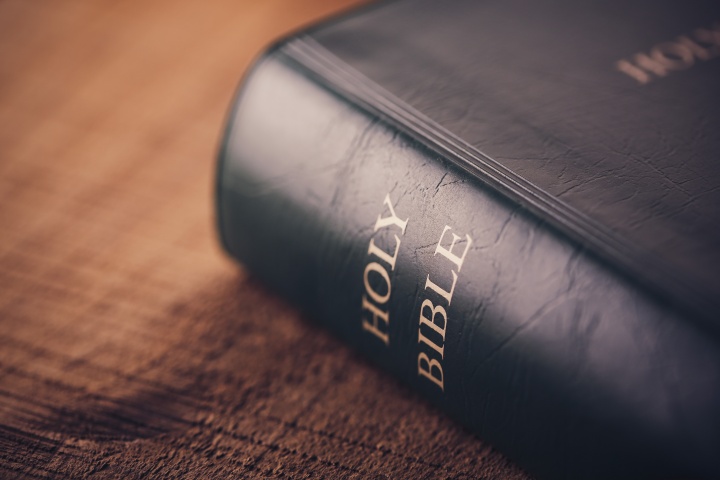 Bible laying on top of a table