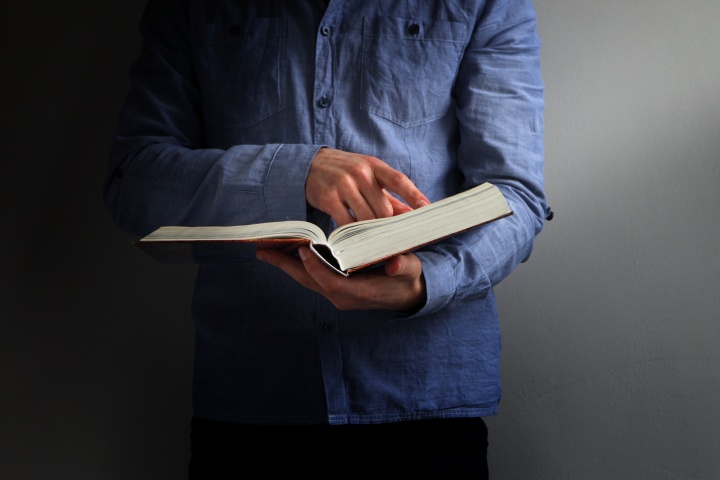 A man reading a Bible.