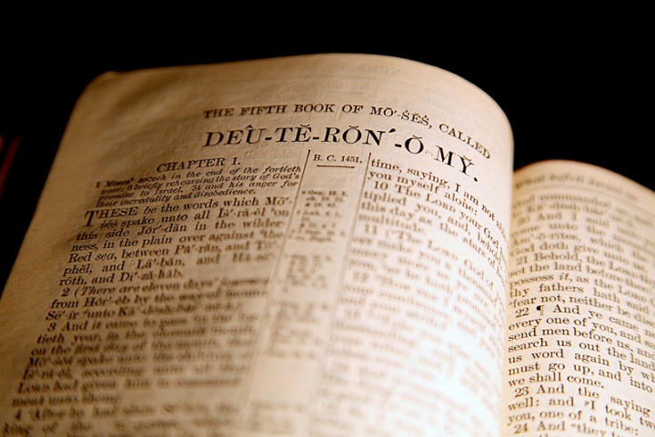 A Bible opened to the Book of Deuteronomy.