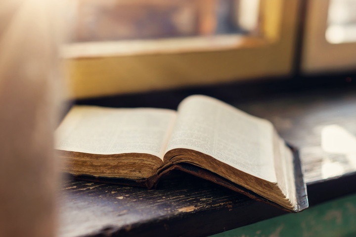 A Bible laying on a table.