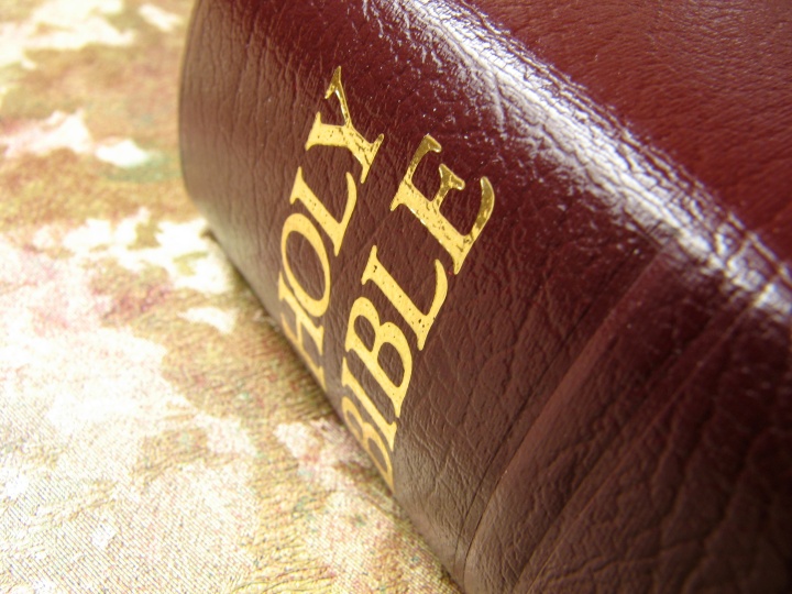 A Bible laying on a table.