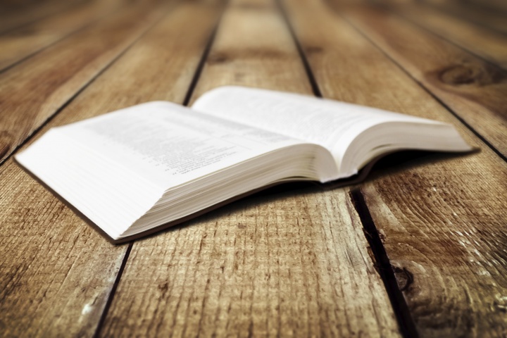 A Bible laying on a table.