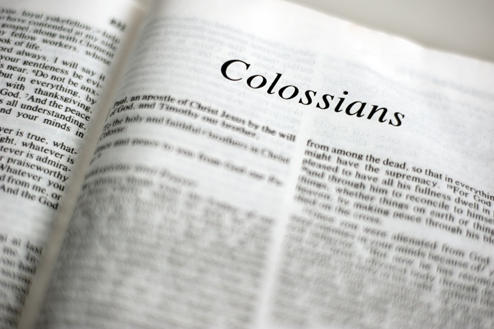 A Bible opened to book of Colossians. 