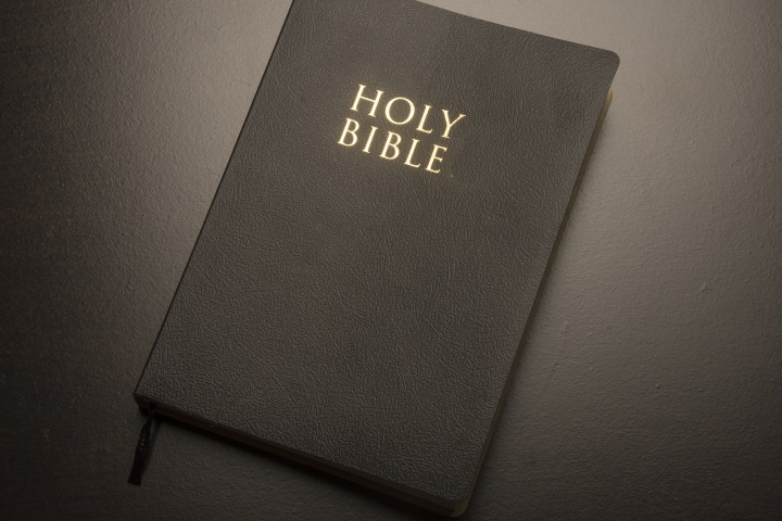 A Bible laying on a table.