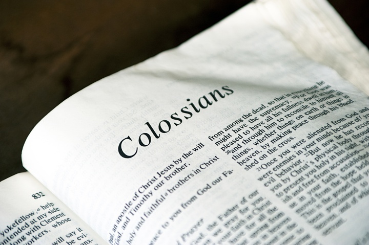 A Bible opened to book of Colossians. 