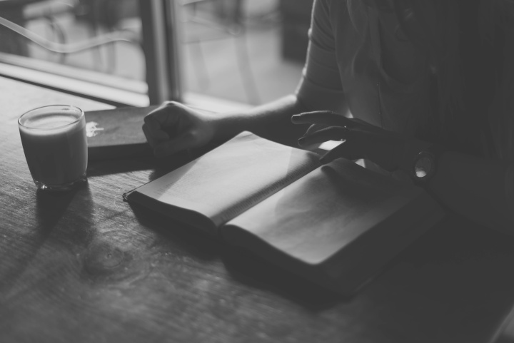 A woman reading a Bible.