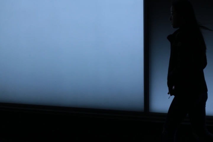 A silhouette of a person walking.