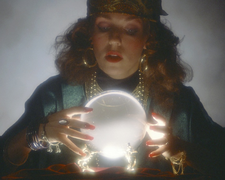Fortune Teller woman with glowing ball.