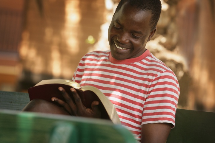 A young man reading the Bible.