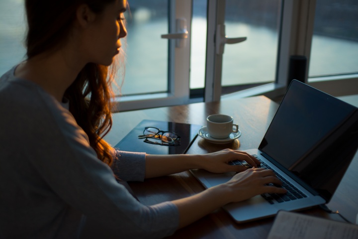 A woman using a laptop computer.