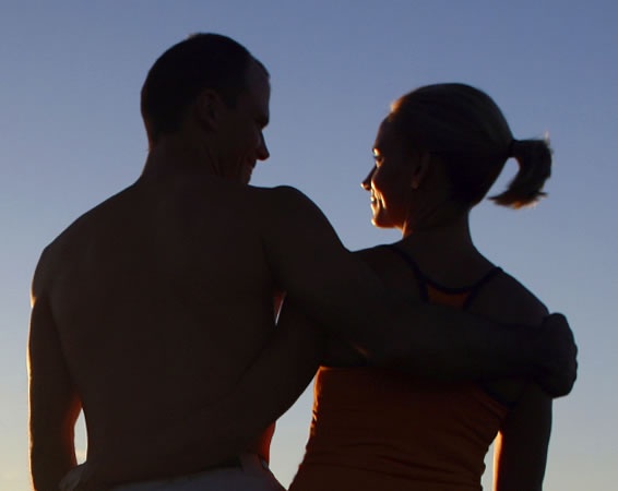 A man and woman standing beside each other.