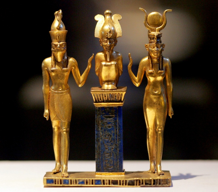 Gold figurines of Egyptian gods Osiris, Horus and Isis