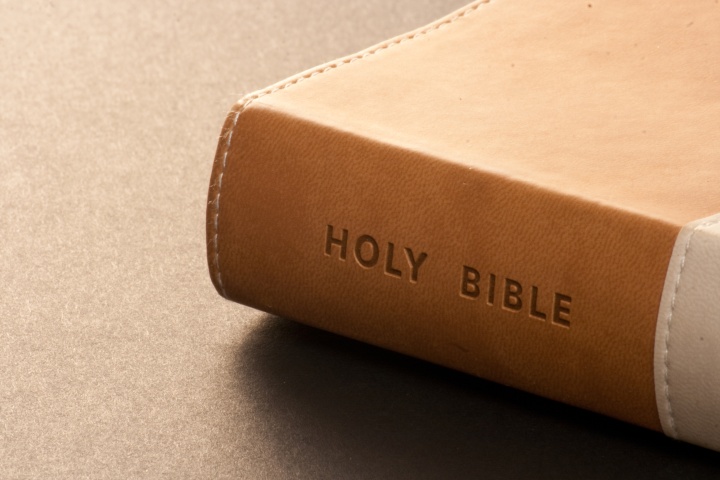 A leather Bible on a table.