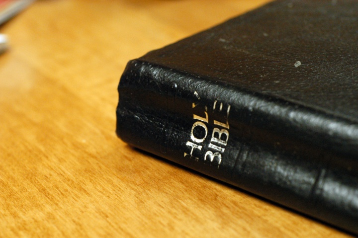 A Bible laying on a table.