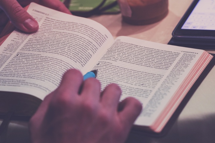 A person reading a Bible.