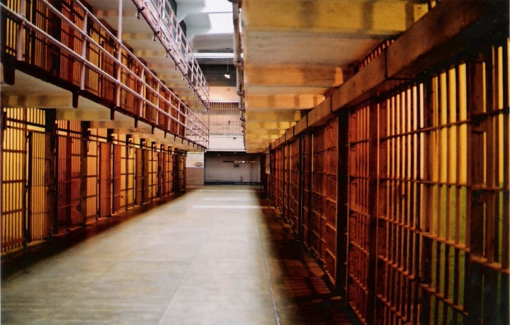 The hallway inside of a prison.