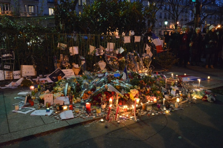 A memorial of candles to recent victim of terrorist act.