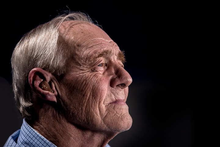 An older man looking away from the camera.