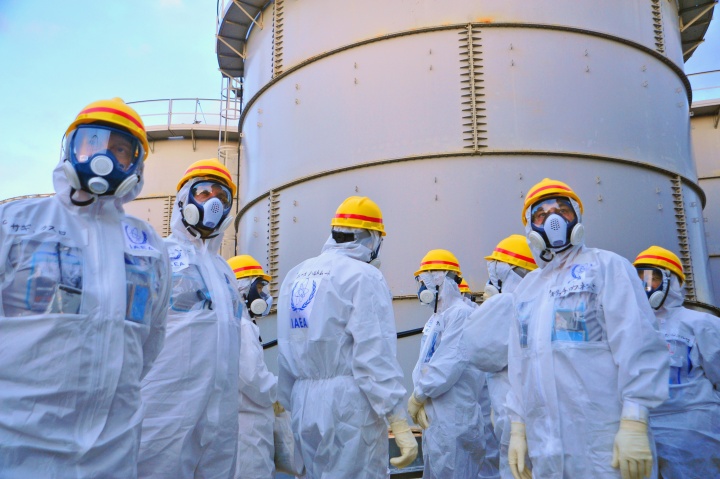 A team of IAEA experts check out water storage tanks.