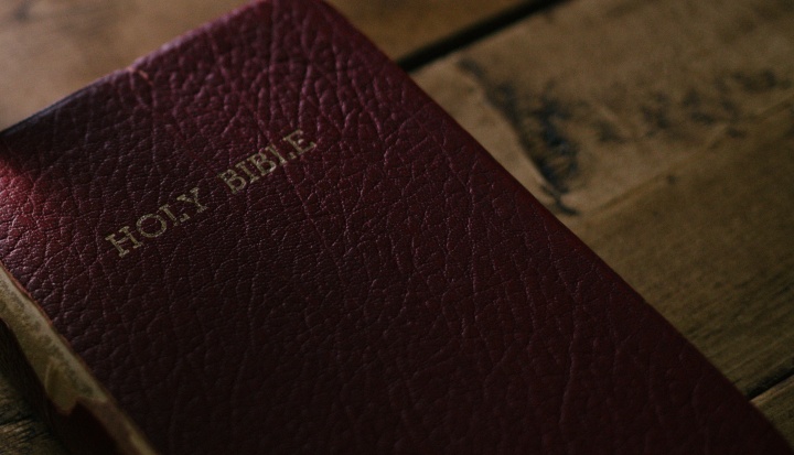 A Bible laying on a table.